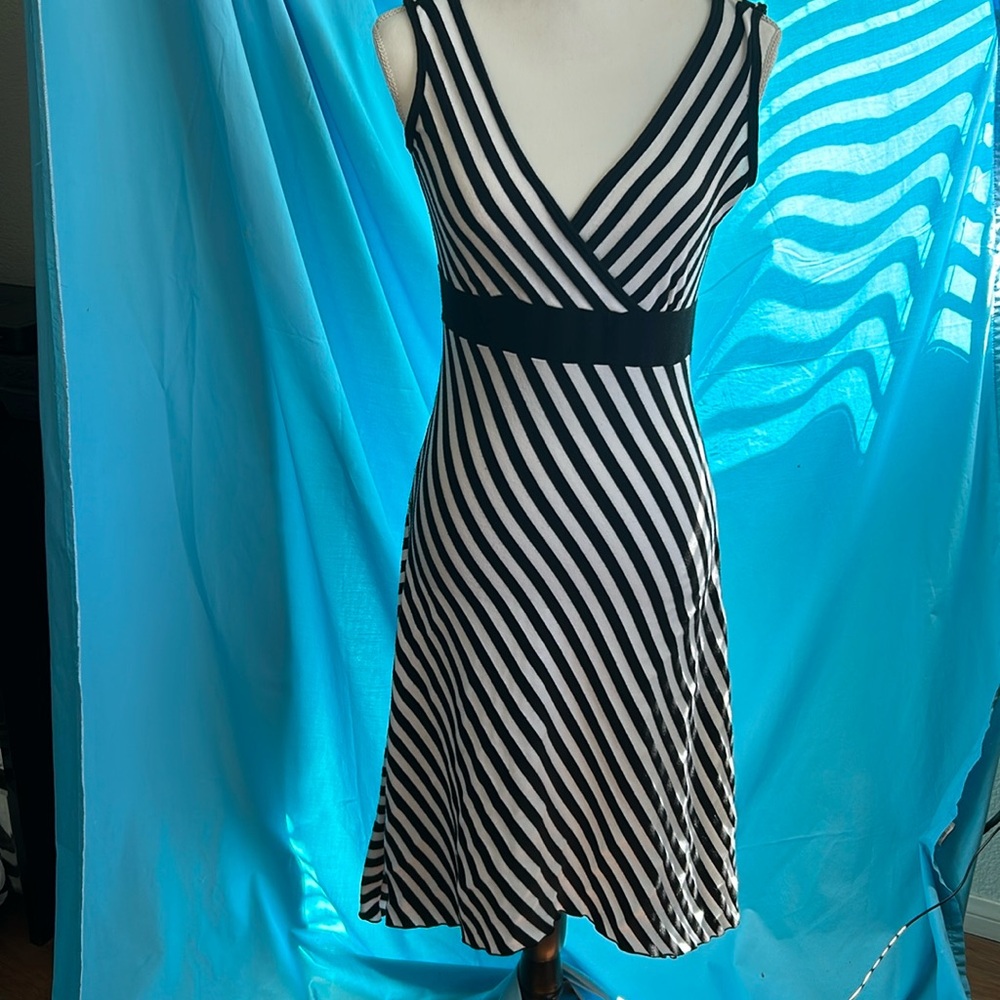 Buy2items get1free 3/$15items for$30. Black& white striped,sleeveless, knit dres